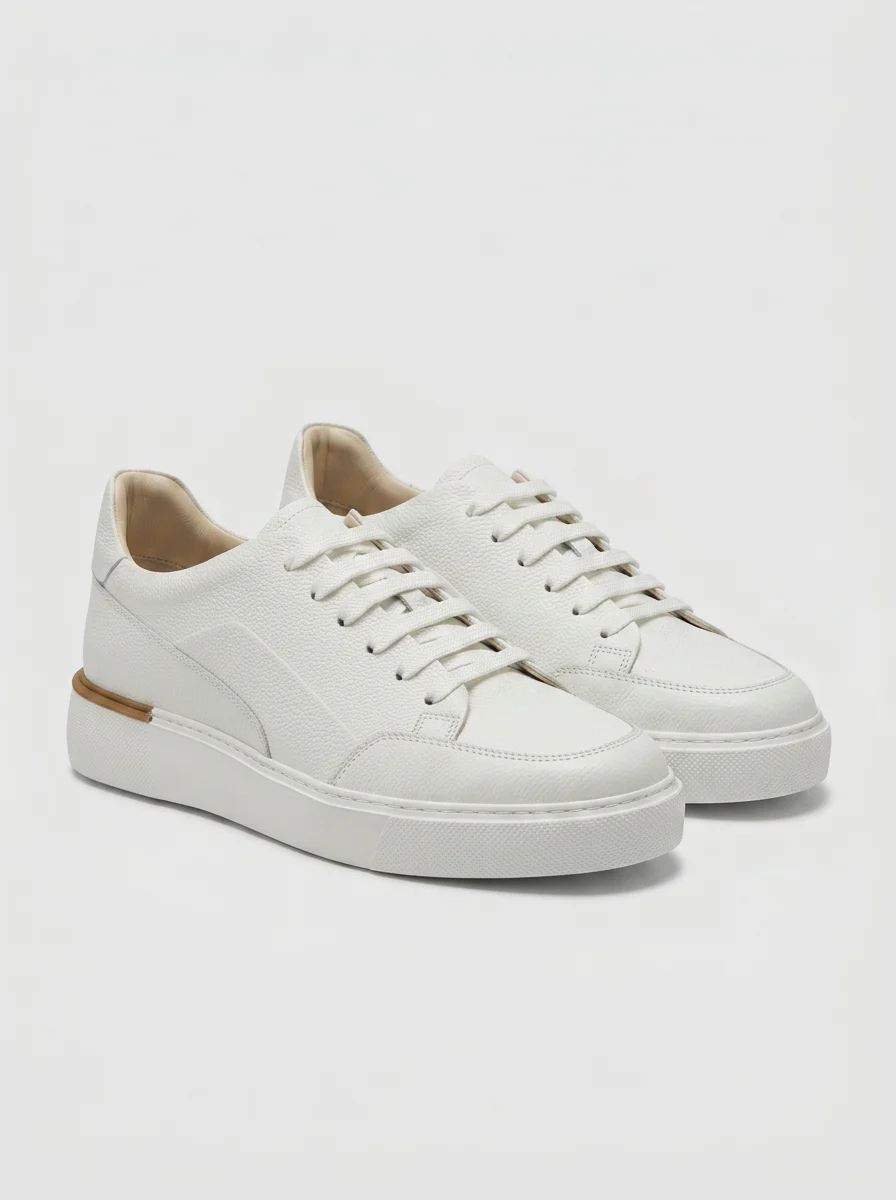 Source product photograph of White leather sneakers