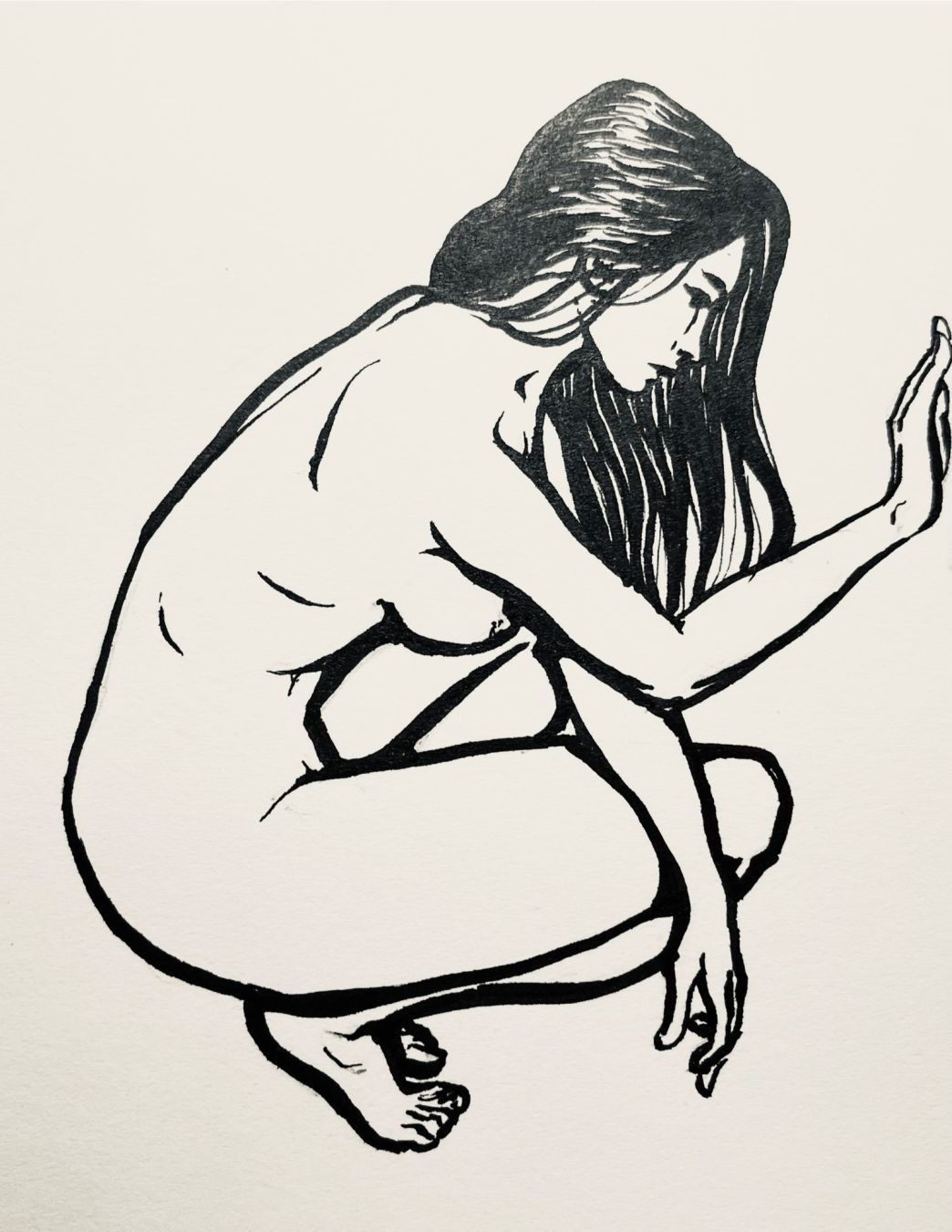 Ink drawing of a crouching nude