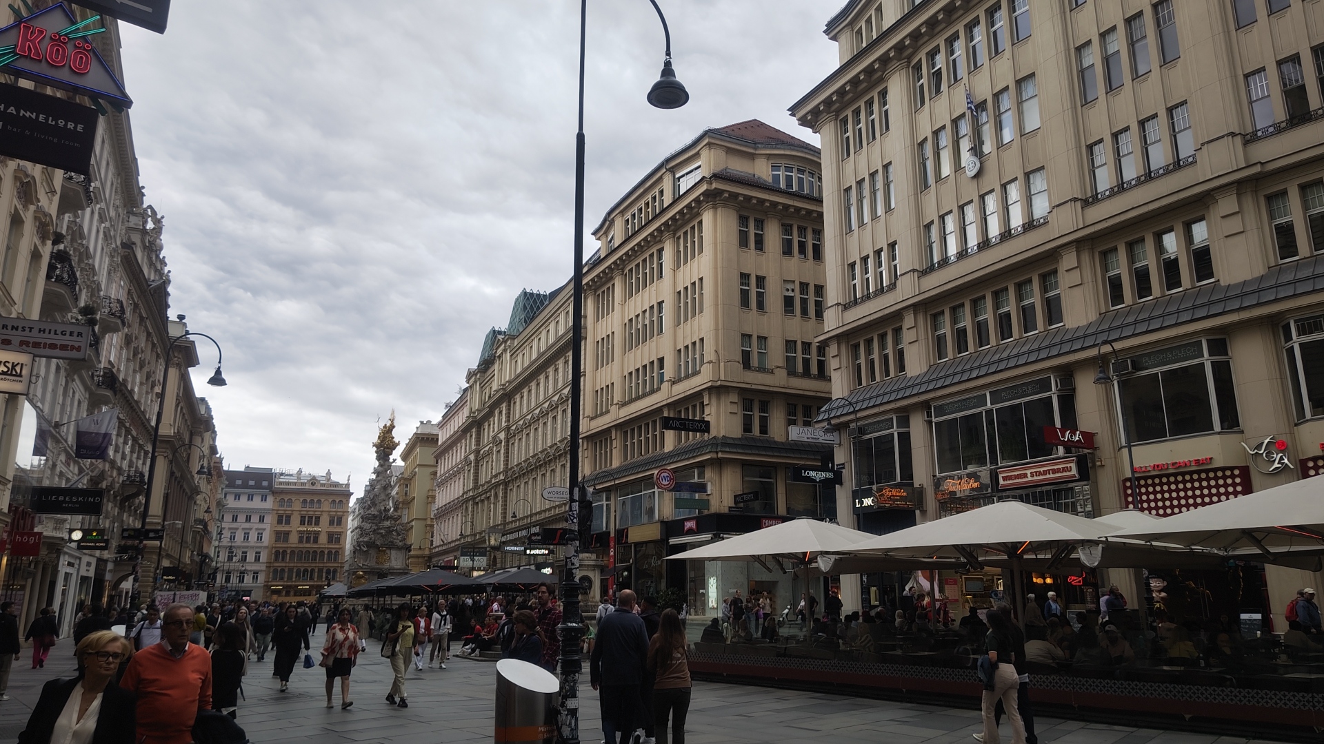 Covered seating and old buildings in a Platz in Vienna