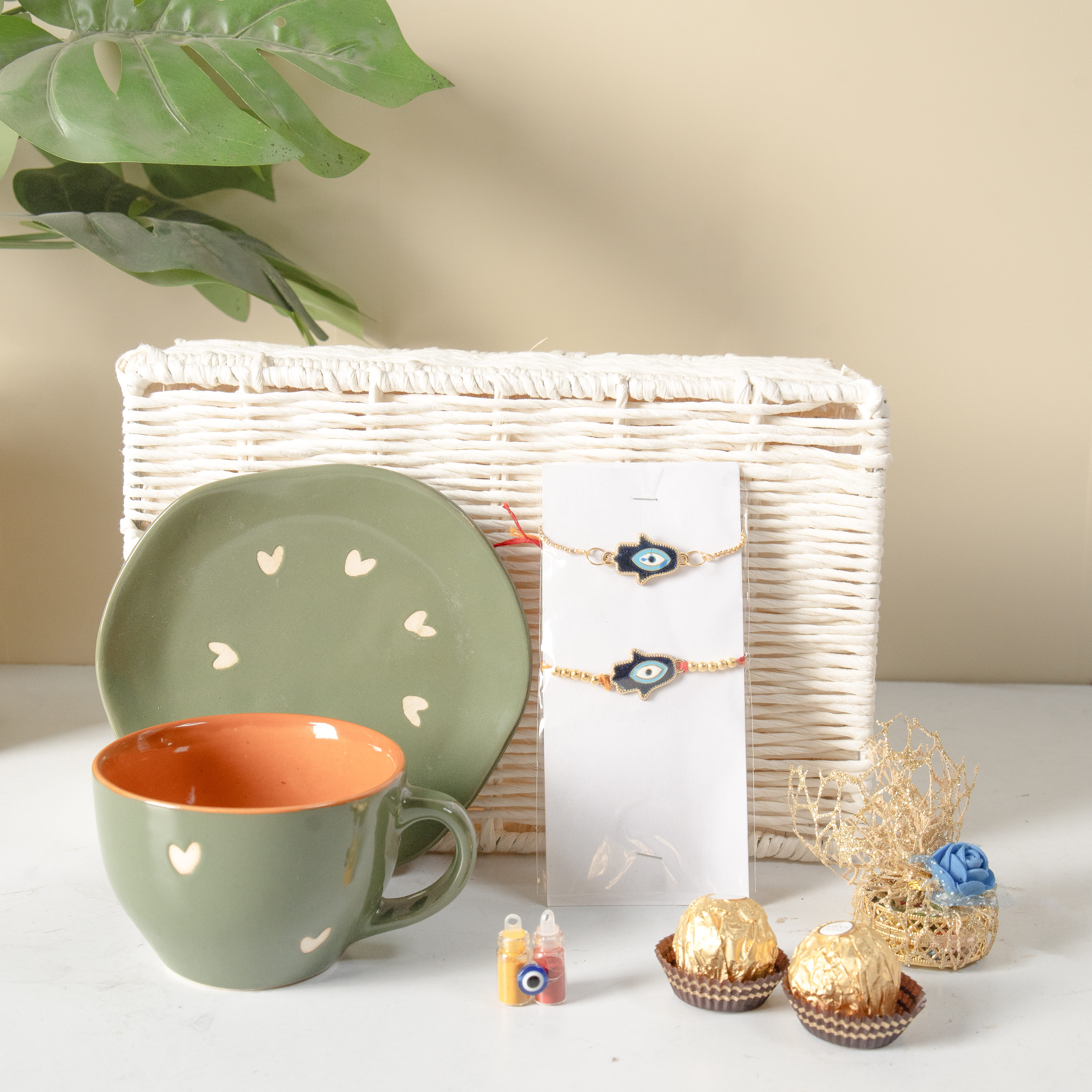 Raksha Bandhan Delight Gift Hamper | Jute Basket | Cup & Saucer | 2 Rakhis | Gola, Roli, Chawal, Chandan