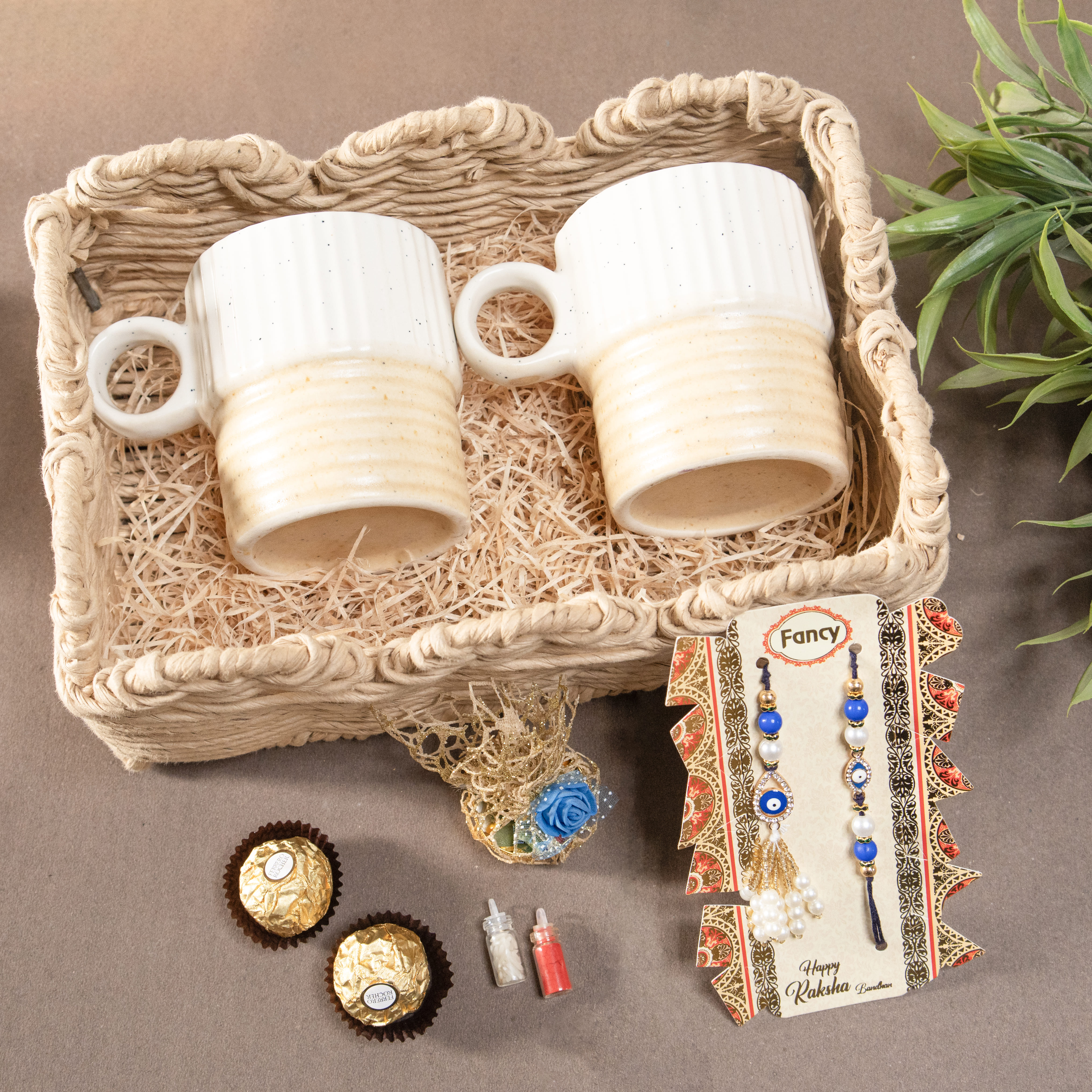 Sip & Celebrate Rakhi Gift Hamper | 2 Rakhis | 2 Cups | Jute Basket | Roli, Chawal